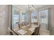Bright dining room featuring a modern light fixture and large windows at 6105 114Th E Dr, Parrish, FL 34219