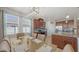 Sunlit dining room featuring modern chandelier and open-concept access to kitchen at 6105 114Th E Dr, Parrish, FL 34219