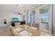 Bright dining area with waterfront view, seamlessly connected to the living room at 6105 114Th E Dr, Parrish, FL 34219