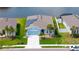 Beautiful home with lush landscaping, solar panels, and a serene water view at 6105 114Th E Dr, Parrish, FL 34219