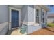 Inviting home entryway featuring a blue door, a 'Welcome' sign and complementary planter at 6105 114Th E Dr, Parrish, FL 34219