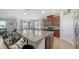 Bright kitchen featuring stainless steel appliances, granite countertops, and eat in bar seating at 6105 114Th E Dr, Parrish, FL 34219