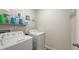 Well-equipped laundry room with shelving and modern washer and dryer at 6105 114Th E Dr, Parrish, FL 34219