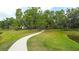 Scenic walking path lined with trees at The Retreat at Willow Bend community at 6105 114Th E Dr, Parrish, FL 34219