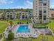 Aerial view of a resort complex featuring a pool, landscaping, and multiple buildings at 700 Golden Beach Blvd # 222, Venice, FL 34285