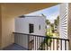Balcony showcasing a view of the nearby beach access path lined with palm trees at 700 Golden Beach Blvd # 222, Venice, FL 34285