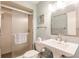 Bathroom with glass shower, large mirror, pedestal sink, and towel bar at 700 Golden Beach Blvd # 222, Venice, FL 34285