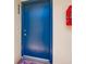 Blue painted front door with silver handle on a cream colored wall at 700 Golden Beach Blvd # 222, Venice, FL 34285