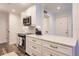 Bright kitchen featuring stainless appliances, white cabinets and granite countertops at 700 Golden Beach Blvd # 222, Venice, FL 34285