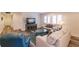 Comfortable living room with wood flooring, stylish furniture, and bright natural light at 700 Golden Beach Blvd # 222, Venice, FL 34285