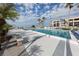 Resort pool featuring multiple seating and lounging options with lush landscaping at 700 Golden Beach Blvd # 222, Venice, FL 34285
