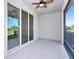 Screened-in balcony with fan and sliding glass doors bringing in natural light at 8657 Milestone Dr, Sarasota, FL 34238