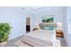 Bright bedroom with a cozy bed, soft lighting, and elegant decor, offering a relaxing atmosphere at 8657 Milestone Dr, Sarasota, FL 34238
