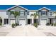 Townhome exterior with garage and a well-maintained front yard, offering an inviting curb appeal at 8657 Milestone Dr, Sarasota, FL 34238