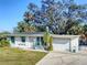 Charming single-story home boasts a well-maintained lawn and attached one-car garage at 240 Pocono E Trl, Nokomis, FL 34275