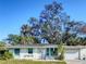 Charming single-story home boasts a well-maintained lawn and attached one-car garage at 240 Pocono E Trl, Nokomis, FL 34275