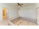 Bedroom featuring carpet, a ceiling fan, natural light, large closet, and a gray upholstered headboard at 10614 Morning Marsh Ln, Parrish, FL 34219