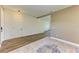 A foyer with wood-look floors, a bright white door, and easy access to the stairs at 10614 Morning Marsh Ln, Parrish, FL 34219
