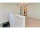 Upstairs hallway featuring carpet, white walls, and a laundry closet with a washing machine at 10614 Morning Marsh Ln, Parrish, FL 34219