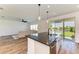 Kitchen island with a view of the living area and the outdoors at 10614 Morning Marsh Ln, Parrish, FL 34219