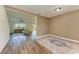 Bright living area featuring wood floors and an open floor plan that leads to the outdoors at 10614 Morning Marsh Ln, Parrish, FL 34219