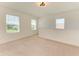 Carpeted loft featuring natural light, white walls, and recessed lighting for a cozy atmosphere at 10614 Morning Marsh Ln, Parrish, FL 34219
