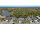 Overhead view of residences with pristine landscaping, showcasing the neighborhood's well-manicured lawns at 12352 Auburndale Ct, Venice, FL 34293