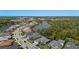 Wide aerial view of the community with lake views and residences at 12352 Auburndale Ct, Venice, FL 34293