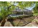 Landscaped backyard with manicured lawn and screened in pool at 12352 Auburndale Ct, Venice, FL 34293