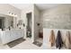Bright bathroom featuring dual vanities and large glass enclosed shower at 12352 Auburndale Ct, Venice, FL 34293