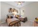 Bedroom with two twin beds and decorative wall hangings at 12352 Auburndale Ct, Venice, FL 34293