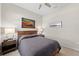 Comfortable bedroom featuring neutral tones and ambient lighting at 12352 Auburndale Ct, Venice, FL 34293