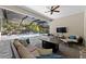 Relaxing lanai with comfortable seating, ceiling fan, and a view of the sparkling screened-in pool at 12352 Auburndale Ct, Venice, FL 34293