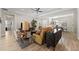 Open-concept living room with modern furniture, decor, and seamless access to dining room at 12352 Auburndale Ct, Venice, FL 34293