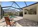 Screened-in pool and patio area with lounge chairs for relaxing and soaking up the sun at 12352 Auburndale Ct, Venice, FL 34293