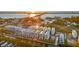 Beautiful aerial view of waterfront homes with a canal leading to the bay at 12413 Gulf Breeze Ter, Cortez, FL 34215