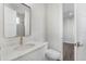 Well-lit bathroom with a modern vanity, brass faucet, and a sleek frameless shower at 12413 Gulf Breeze Ter, Cortez, FL 34215