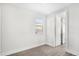 Bright bedroom featuring laminate flooring and a large window with natural light at 12413 Gulf Breeze Ter, Cortez, FL 34215