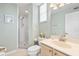 Bright bathroom with a glass-enclosed shower, neutral tones, and updated fixtures at 1260 Dolphin Bay Way # 404, Sarasota, FL 34242