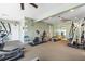 Spacious fitness center with modern equipment, ample lighting, and a variety of exercise options at 1260 Dolphin Bay Way # 404, Sarasota, FL 34242