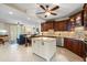 Open floor plan showcasing an island kitchen with countertops and stainless steel appliances at 1260 Dolphin Bay Way # 404, Sarasota, FL 34242