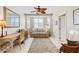Cozy living room includes a comfortable couch, desk area, and plenty of natural light at 1260 Dolphin Bay Way # 404, Sarasota, FL 34242