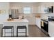 Bright kitchen featuring stainless steel appliances, a large island, and modern white cabinetry at 13038 Bayberry Way, Parrish, FL 34219