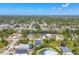 Scenic aerial view of a neighborhood with beautiful homes, lush greenery, and expansive surroundings at 145 Baytree Dr, Rotonda West, FL 33947