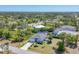 Panoramic aerial view of a property with a screened pool and lush landscaping at 145 Baytree Dr, Rotonda West, FL 33947