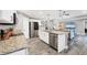 Open kitchen view showcases granite counters, stainless steel appliances, and flows seamlessly into the living area at 145 Baytree Dr, Rotonda West, FL 33947