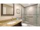 Modern bathroom with a tiled glass shower, granite countertop, and stylish fixtures at 1610 Treehouse Cir # T130, Sarasota, FL 34231