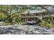 Property featuring a carport and mature shade trees providing privacy in a great neighborhood at 1610 Treehouse Cir # T130, Sarasota, FL 34231