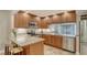Updated kitchen featuring stainless steel appliances and a breakfast bar for casual dining at 1610 Treehouse Cir # T130, Sarasota, FL 34231