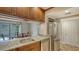 Kitchen with granite counters, stainless appliances and dining area view at 1610 Treehouse Cir # T130, Sarasota, FL 34231